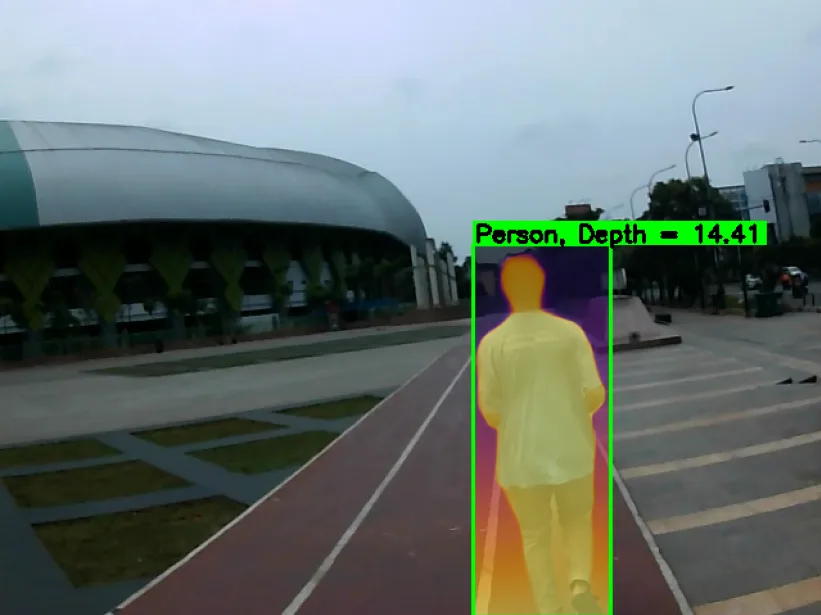 A person detected ahead with an estimated depth value printed above the box